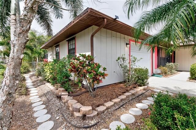 County Listing 7875 94th Court​ side yard